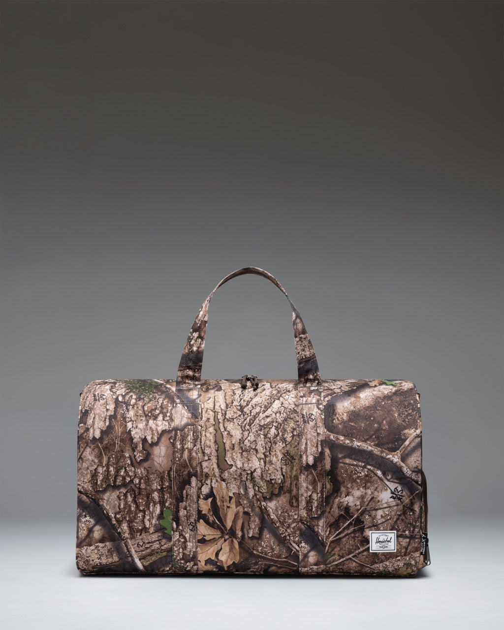 herschel-supply-novel-duffle-bag-with-realtree-apx-camo-carry-on-size-shoe-compa image 1